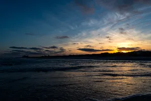 Take In The Beauty Of A Calm And Peaceful Sea Sunset. Wallpaper