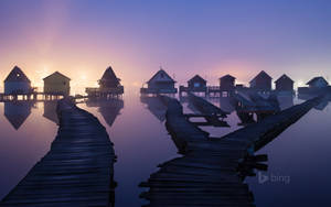 Take In The Views And Serenity Of Overwater Bungalows In Tahiti Wallpaper