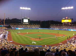 Taking In A Ballgame At Dodger Stadium Wallpaper