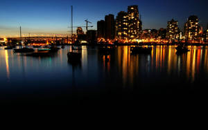 Taking In The Cityscape By The Pier Wallpaper