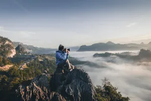 Taking Landscape Photography At Mountain Peak Wallpaper