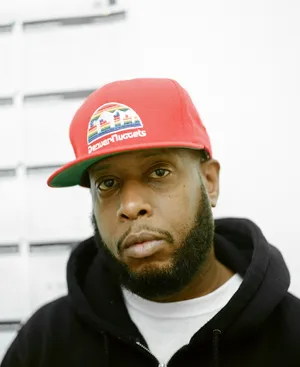 Talib Kweli Portrait Denver Nuggets Hat Wallpaper