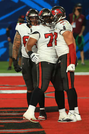 Tampa Bay Buccaneers Offensive Linemen Huddle Wallpaper