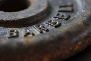 Tarnished Barbell Plate Wallpaper