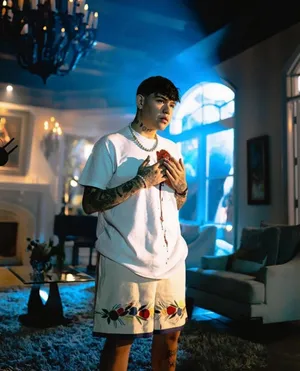 Tattooed Man Holding Heart Wallpaper