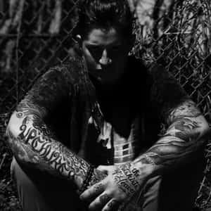 Tattooed Man Nighttime Portrait Wallpaper