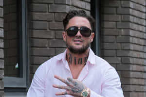 Tattooed Manin Pink Shirtand Sunglasses Wallpaper