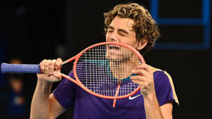 Taylor Fritz Posing With His Racket Wallpaper