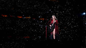 Taylor Swift Eras Tour Performance Under Stars Wallpaper