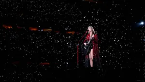 Taylor Swift Eras Tour Performance Under Stars Wallpaper