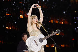 Taylor Swift Heart Gesture Concert Wallpaper