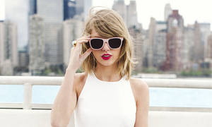 Taylor Swift Strikes A Pose In All White Wallpaper