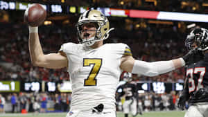 Taysom Hill Action Shot New Orleans Saints Wallpaper