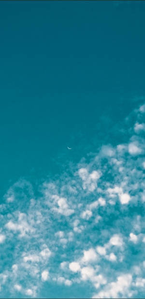 Teal Sky And White Clouds Wallpaper