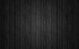Tech Style - Black Mac On Wooden Table Wallpaper