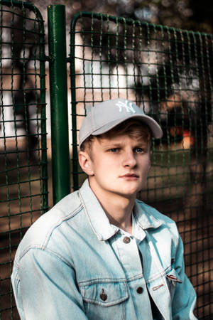 Teenage Guy Wearing Denim Jacket Wallpaper