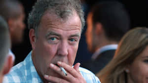 Television Presenter Jeremy Clarkson Enjoying A Drive Wallpaper