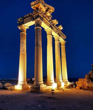 Temple Of Apollo Is Exceptionally Beautiful At Night Wallpaper