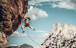 Tenacious Woman Hand Grip Wallpaper