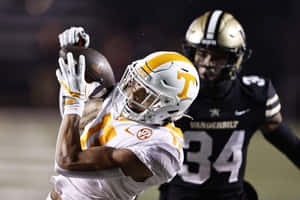 Tennessee Receiver Catching Football Wallpaper