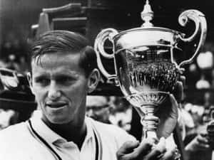 Tennis Champion Roy Emerson With Trophy Wallpaper