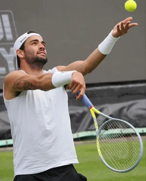 Tennis Player Matteo Berrettini Ball Toss Wallpaper