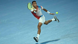 Tennis Prodigy Felix Auger Aliassime In Action Wallpaper