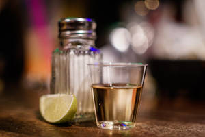 Tequila Shot With Lime Slice And Saltshaker Wallpaper