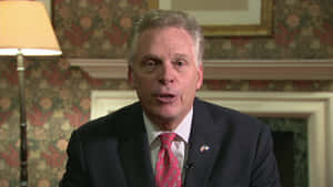 Terry Mcauliffe, An Influential American Politician, Delivering A Speech. Wallpaper