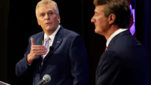 Terry Mcauliffe Debating With Glenn Youngkin Wallpaper