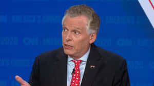 Terry Mcauliffe With Blue Cnn Background Wallpaper