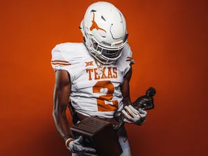 Texas Football Holding Trophy Wallpaper