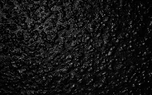 Textured Black Surface Abstract Wallpaper