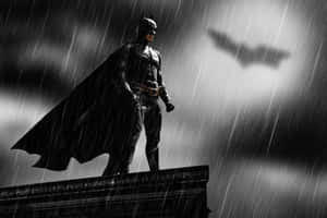 The Bat Signal Shining Bright In The Night Sky Wallpaper