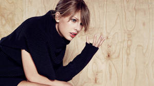 The Beautiful Taylor Swift Enjoying A Scenic Nature View. Wallpaper