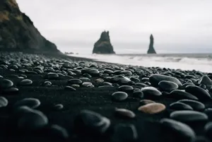 The Beauty Of A Black Sand Beach In The Mediterranean Wallpaper