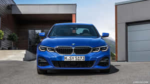 The Blue Bmw X3 Gran Coupe Is Parked In Front Of A House Wallpaper