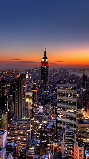 The Breathtaking Sunset Above The Iconic Empire State Building In New York City. Wallpaper