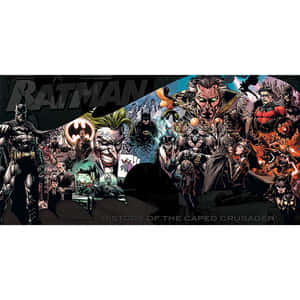 The Caped Crusader Standing Tall In The Shadowy Night Wallpaper