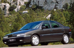 The Classic Citroen Xantia Cruising On The Road Wallpaper