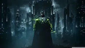 The Dark Knight Looms Over The Skyline Of Batman City. Wallpaper
