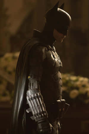 The Dark Knight Preparing For Battle With A Detailed Bat-suit Wallpaper