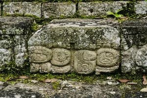 The Enigmatic Mayan Ruins Of Copan Under A Brilliant Blue Sky Wallpaper