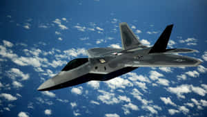 The F-22 Raptor Sleekly Flying Through The Sky Wallpaper