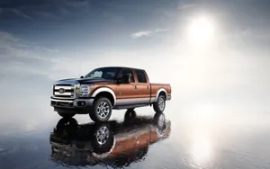 The Ford Super Duty F-250 Is Parked On A Rocky Surface Wallpaper