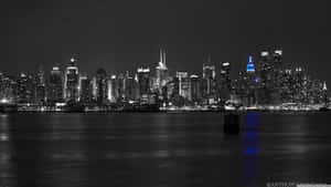 The Glorious New York City Skyline At Night Wallpaper