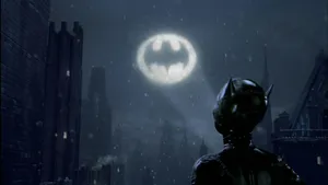 The Iconic Bat-signal Illuminating The Night Sky Over Gotham City Wallpaper