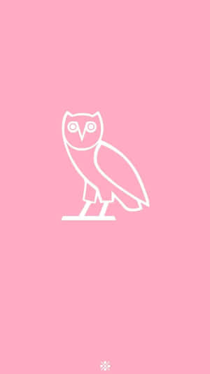 The Iconic Drake Ovo Owl Lights Up On An Apple Iphone 8. Wallpaper