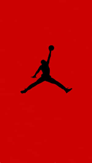 The Iconic Jordan Logo Stands Out Against A Modern Smartphone. Wallpaper