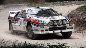 The Iconic Lancia Automobile In Action Wallpaper